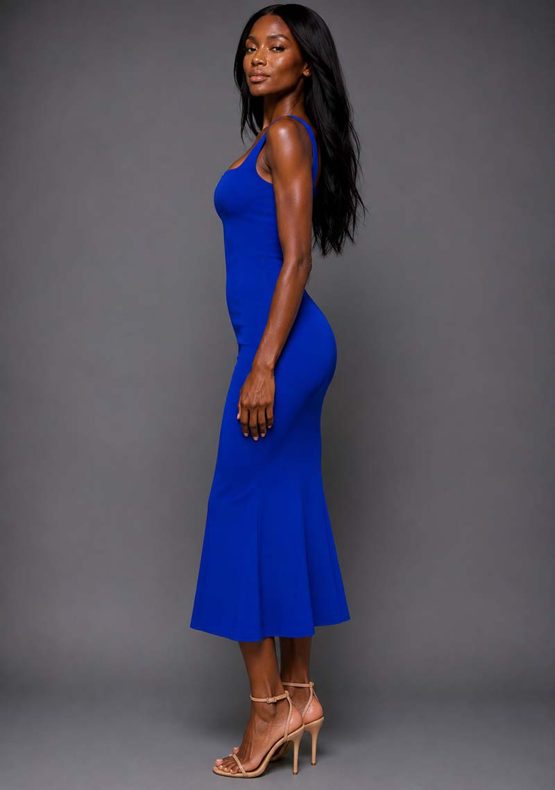 Side front image of a model wearing the VSPR Marianna Square Neckline Fishtail Cobalt Midaxi Dress in Cobalt Blue from a side front angle, featuring wide straps, a fitted silhouette, and graceful mermaid hem.