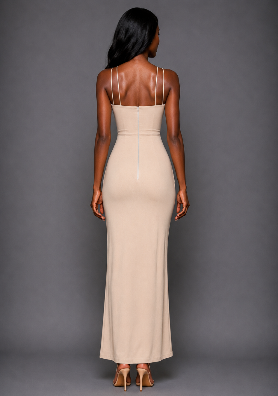 Back image of a model wearing the VSPR Auralia High Neck Strappy Stone Maxi Dress, highlighting the elegant double fine straps and sleek body-skimming silhouette against a grey studio backdrop.