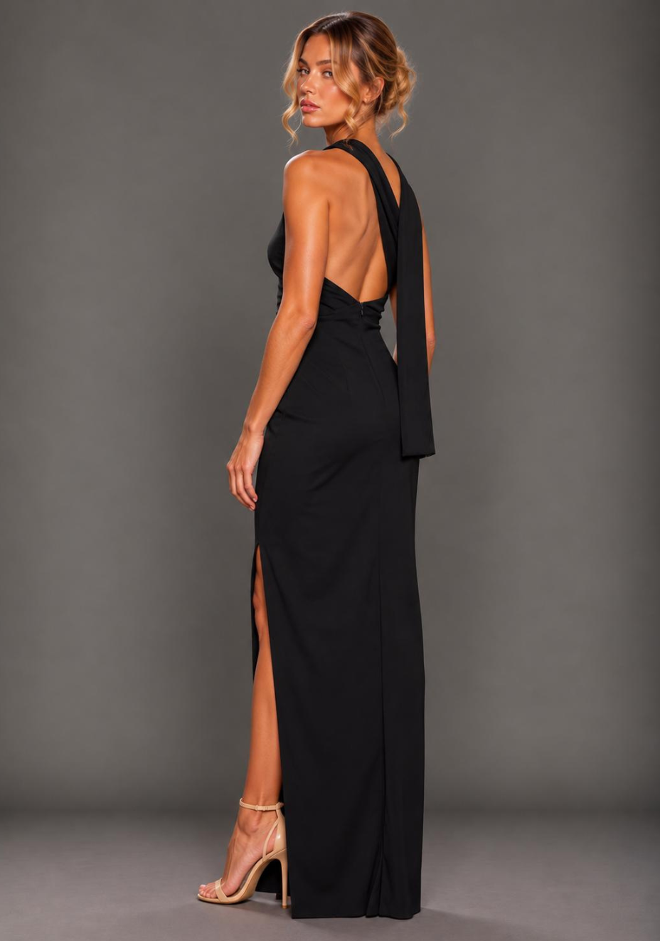 Side-back image of a model wearing VSPR Kendall Strappy Sweetheart Navy Midaxi Dress, capturing the delicate straps and smooth, figure-hugging silhouette.