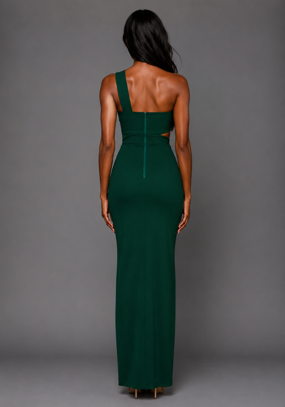Back image of a model wearing the Vesper Hayden Asymmetrical Maxi Dress in Forest Green, showcasing the sleek back design and elongated maxi silhouette.
