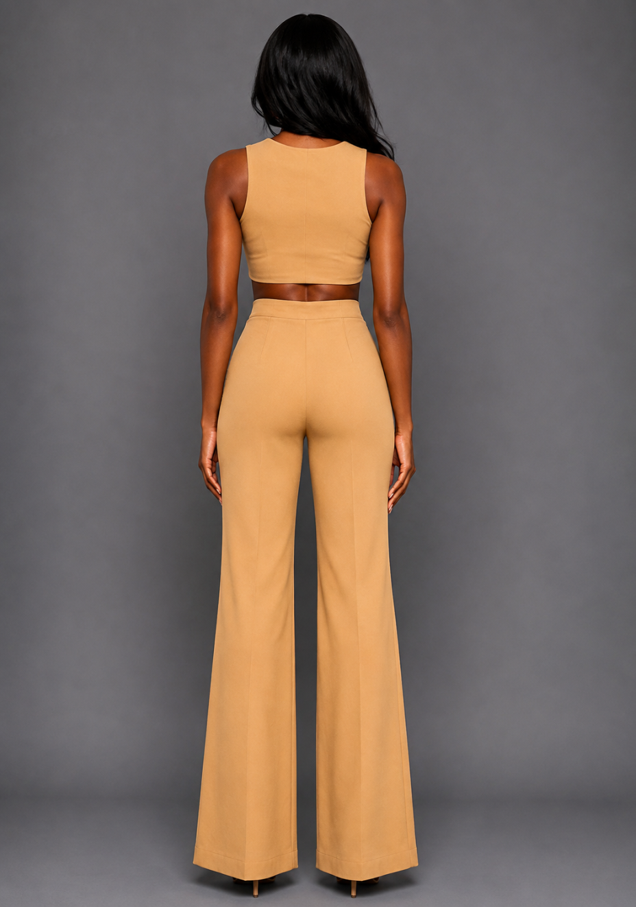 Back image of a model wearing the VSPR Shea Coffee Wide Leg Trousers with a high-rise waist and wide-leg silhouette, styled with the matching VSPR Mia Square Neck Coffee Crop Top, standing against a grey studio backdrop.