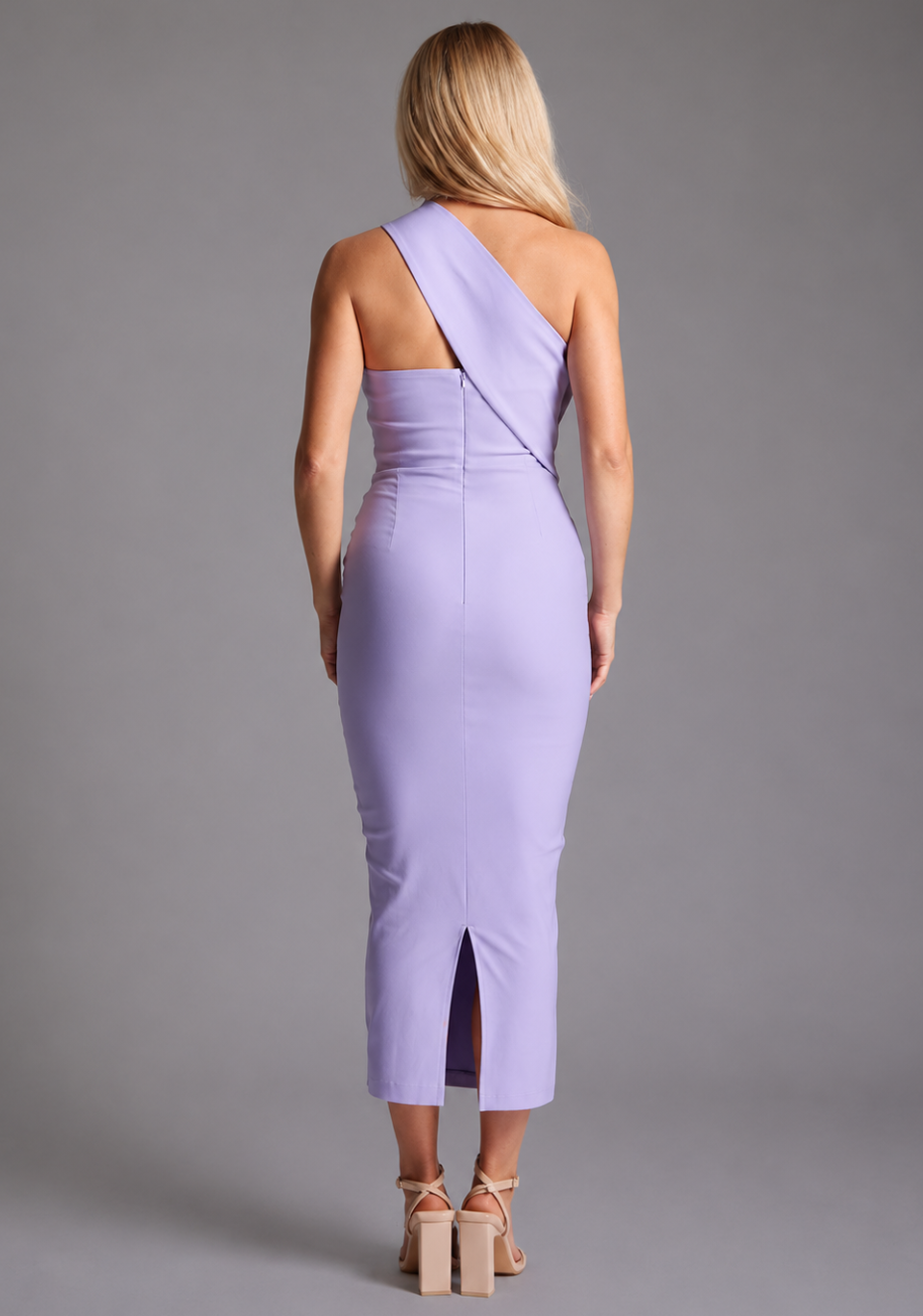 Vesper lilac one shoulder midaxi dress with asymmetric neckline and fitted silhouette, back view on blonde model against grey studio background. 
