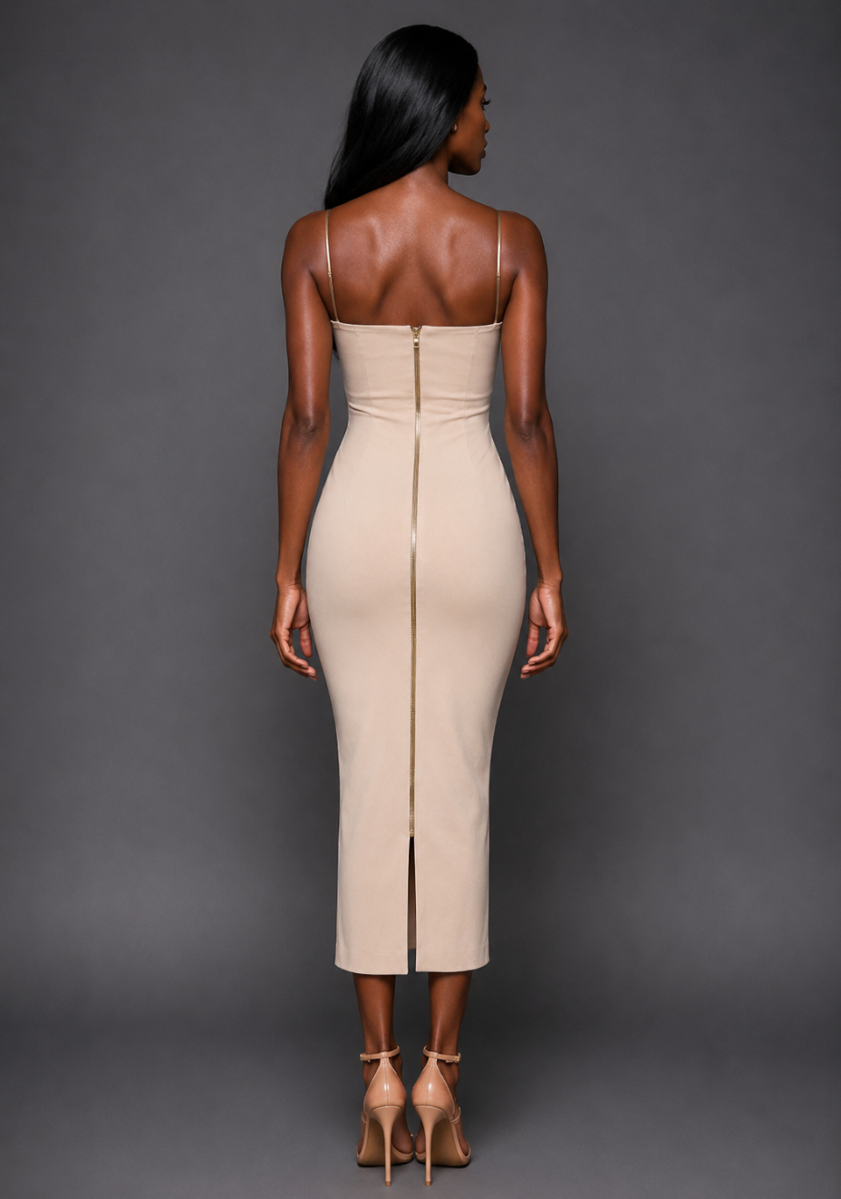 Back image of a model wearing the VSPR Viola Cami Strap Plunge Stone Midaxi Dress, showcasing the full-length gold zip detail and sleek fitted silhouette against a grey studio backdrop.