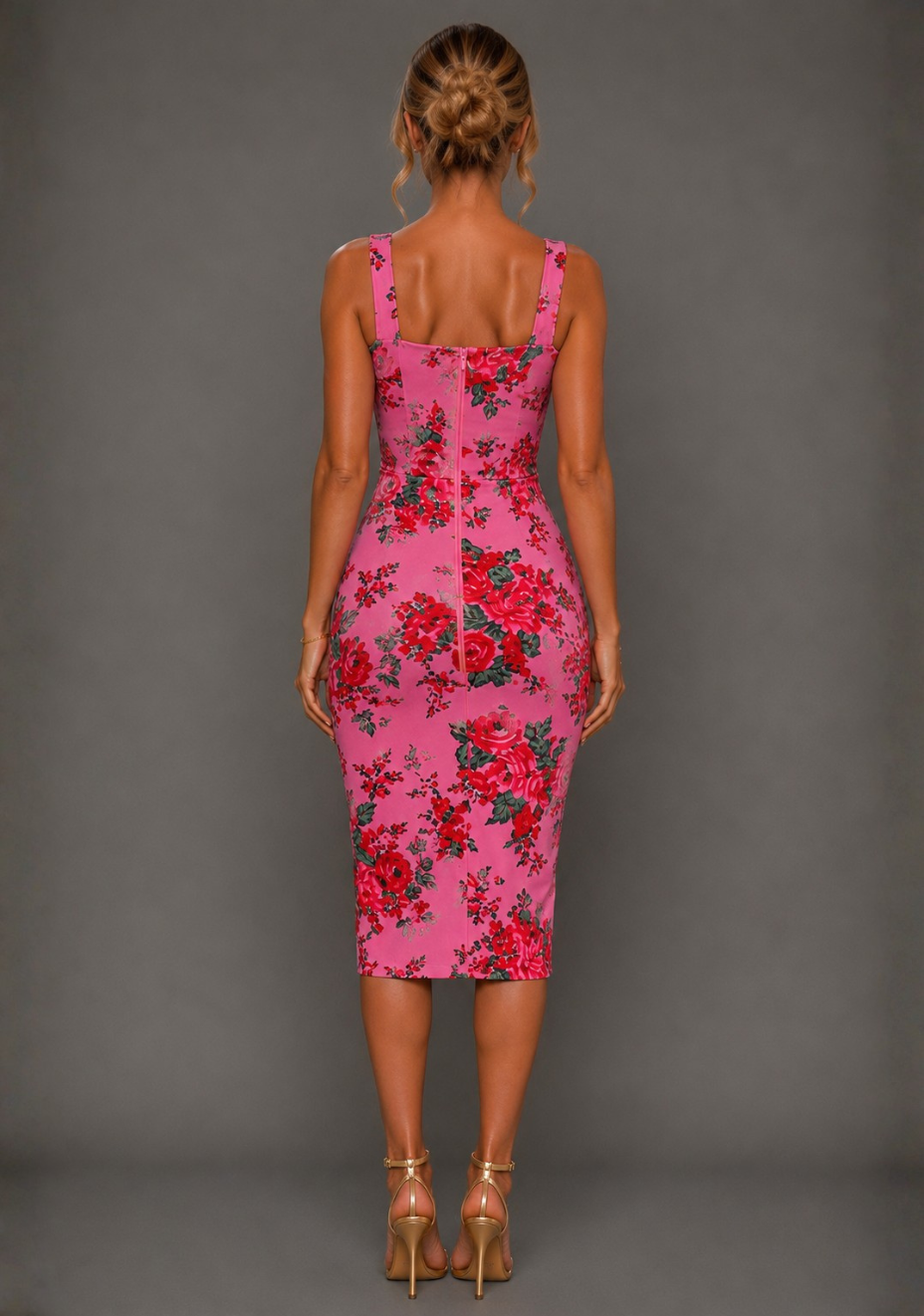 Back image of a model wearing the Vesper Zada Square Neck Pink Floral Midi Dress highlighting the square neckline, fitted silhouette and pink floral print.